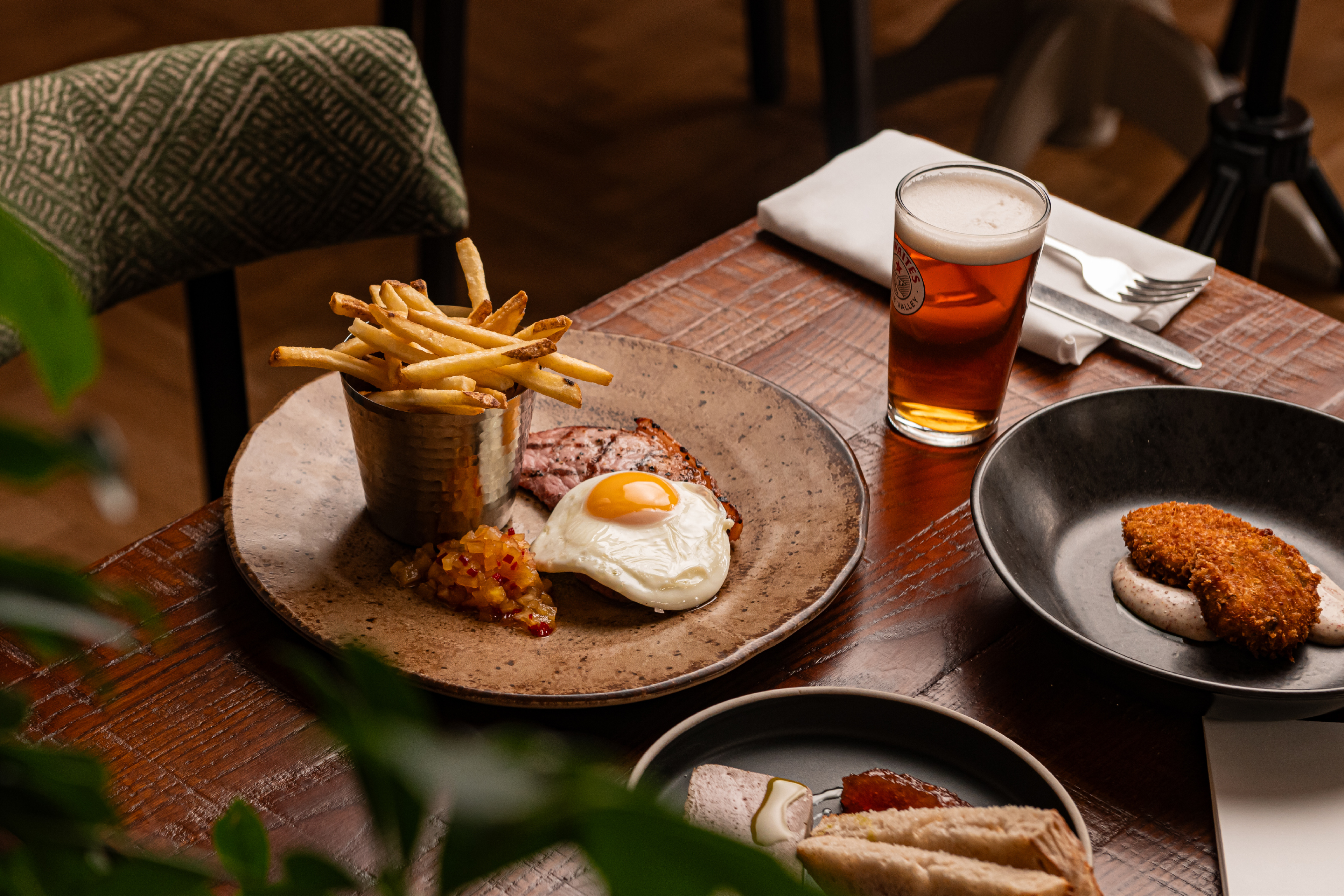 Gammon, egg and chips lunch dish Eating in Pooley Bridge Home-cooked food, made from scratch by our chefs Local, fresh and full of flavour using top quality seasonal produce from the best suppliers. We pride ourselves in creating hearty dishes for you to enjoy, championing our producers passion throughout our menu, capturing the seasons of the Lake District. With our restaurant overlooking the River Eamont, perfect for catching up with friends and family, or perhaps the cosiness of our bar area where dogs are welcome to settle down in front of the fire is more your thing. You’ll feel that warm embrace as soon as you step through the door. View Menus Book a Table