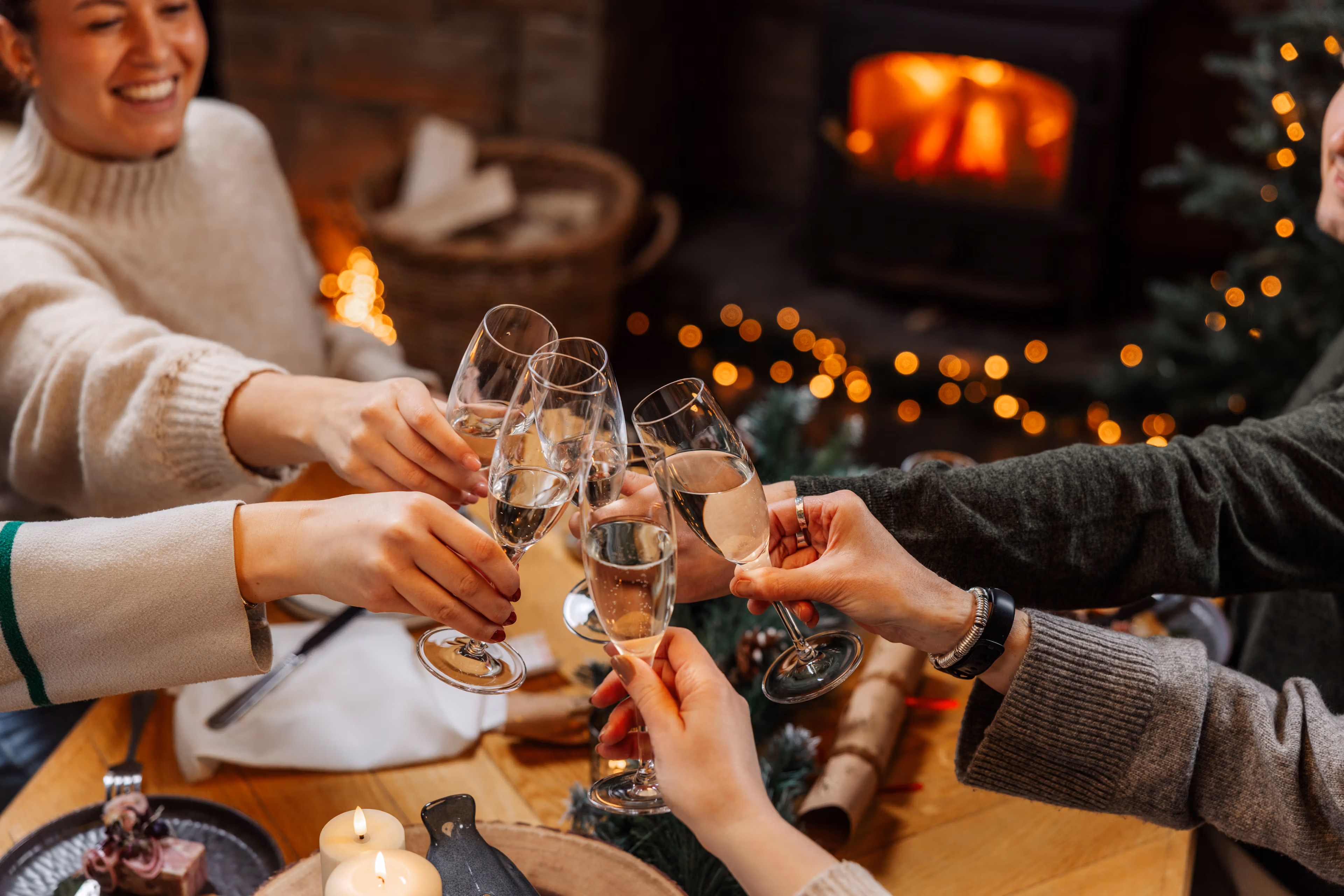 Group of people celebrating with a glass of fizz